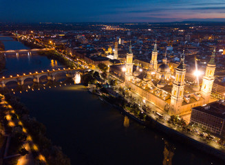 Naklejka premium Night aerial view of Zaragoza with Basilica