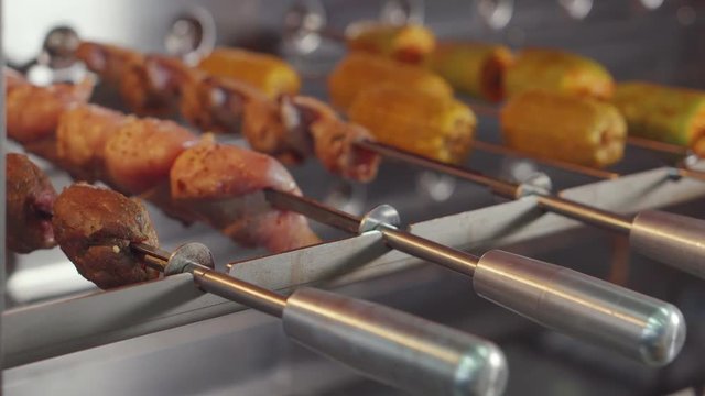 Raw meat and vegetables in oven.
