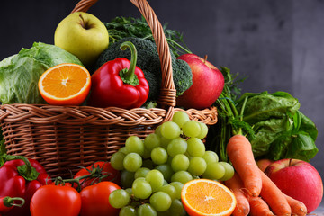 Fresh organic fruits and vegetables in wicker basket