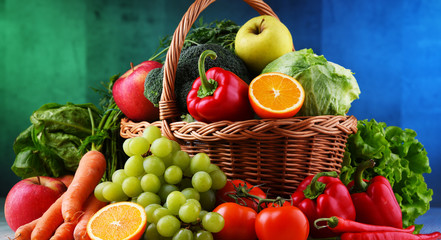 Fresh organic fruits and vegetables in wicker basket