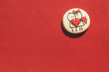 homemade pastry with love isolated on red background
