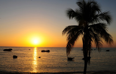 Naklejka na ściany i meble Cuba: Sunset at the beach of Trinidad City