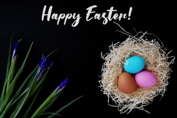 Greeting card happy easter colored eggs and nest.