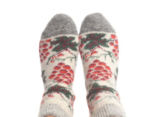 Wool socks on woman's feet isolated on white background