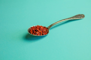 Various spices, beautifully laid out on tablespoons