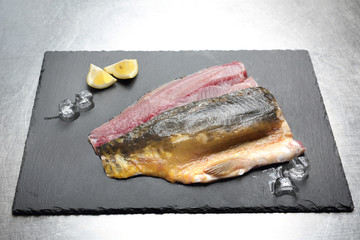 Karp filet na kamiennej desce. © foodandcook