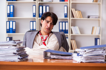 Crazy young man in straitjacket at the office 