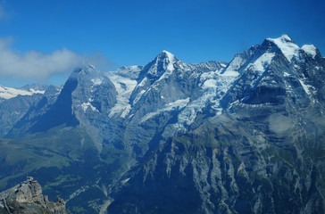 Swiss alps: Paragliding at Schilthorn viewing Eiger, Mönch and Jungfrau peaks above Grindelwald in the Bernese Oberland