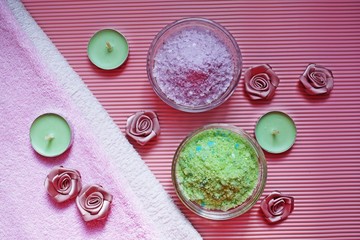 Colorful bath salt on pink background.Healthy skin care.