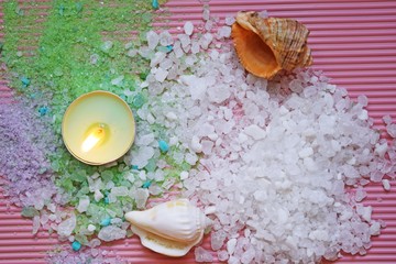 Colorful bath salt on pink background.Healthy skin care.