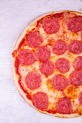 Sausage pizza with cheese of a motsarrel and oregano 