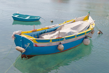 Colorful traditional fishing boats in the harbor in Malta