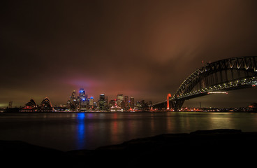 sydney harbour bridge and skyline at night