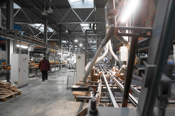 Workers perform their tasks in the shop production plant