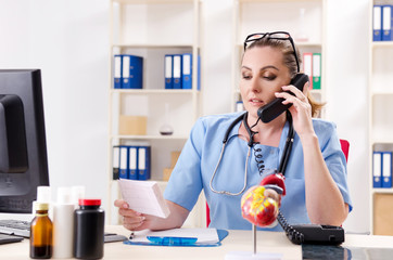 Female doctor cardiologist working in the clinic 