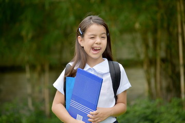 Fototapeta premium Diverse Student Child Making Funny Faces With Books