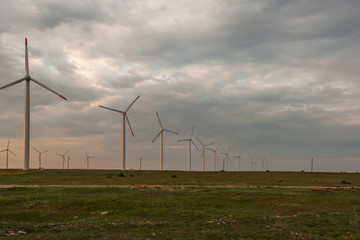 Sunset landscape with Wind turbines near Kaliakra Cape at Black Sea Coast,  Dobrich Region, Bulgaria,