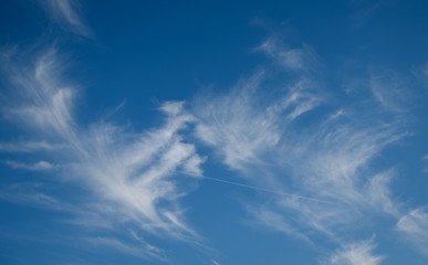 Spindrift clouds against the blue sky