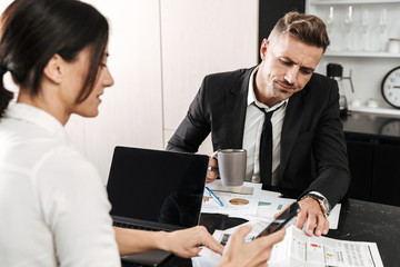 Two colleagues working on a project together