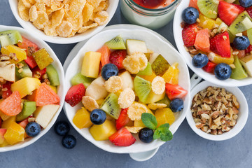 healthy breakfast with fresh fruit salad, top view
