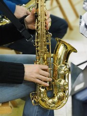 Obraz premium Sax and female hands.