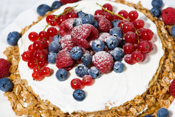 healthy oatmeal cake with yogurt and fresh berries, closeup