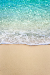 Naklejka na ściany i meble Soft blue ocean wave on clean sandy beach
