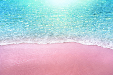 pink sandy beach and soft blue ocean wave summer concept background - obrazy, fototapety, plakaty