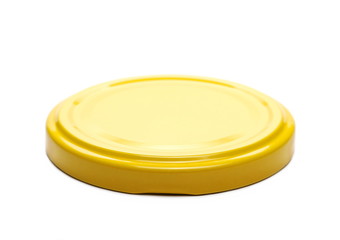 Yellow juice bottle lid isolated on white background