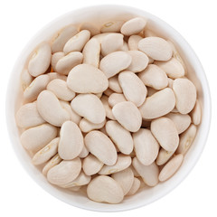 Dried lima beans in a white bowl. View from above. Isolated on white background.
