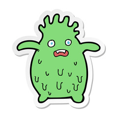 sticker of a cartoon funny slime monster