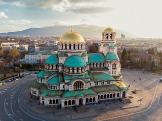 Orthodox Cathedral Alexander Nevsky, in Sofia, Bulgaria. Aerial photography in the sunset - obrazy, fototapety, plakaty