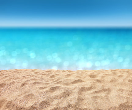 beautiful sandy beach with blur ocean background summer concept