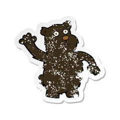 retro distressed sticker of a cartoon waving black bear