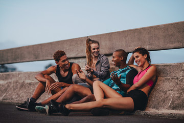 Fitness group resting after workout