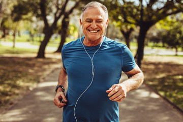 Senior man jogging - Powered by Adobe