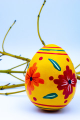 Colorful wooden easter eggs and chocolate with a touch of spring