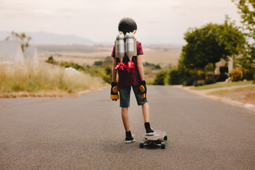 Jetpack boy with skateboard