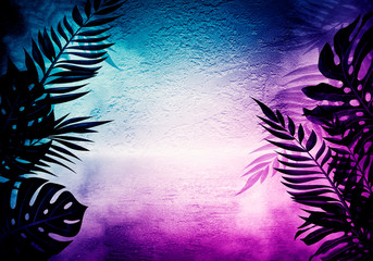 Background of an empty room with brick walls and neon lights. Silhouettes of tropical leaves,...