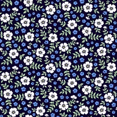 Gordijnen Naadloos ditsy bloemenpatroon in vector. Kleine blauwe en witte bloemen op een donkerblauwe achtergrond. © Olga Frollen