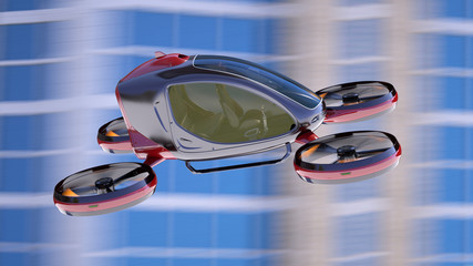 Electric Passenger Drone flying in front of buildings.