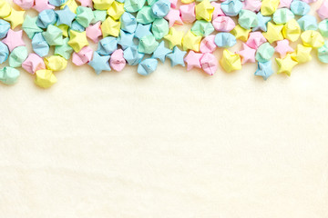 Beautiful background with light multi-colored paper stars