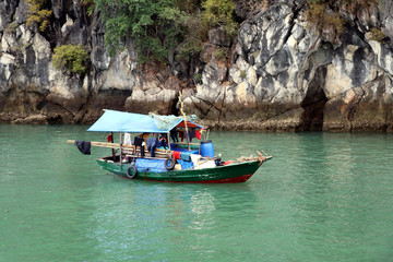 Fototapeta na wymiar Halong Bay houseboat or fishing boat - Vietnam Asia