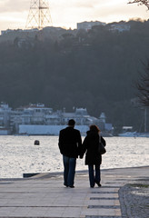 Lovers walking at Rumeli Fortress Seaside in Bosphorus, Istanbul, Turkey.