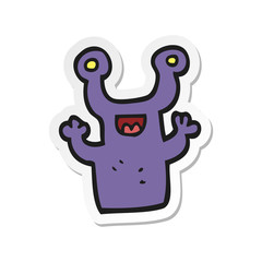 sticker of a cartoon little alien