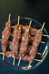 Raw lule kebabs overhead