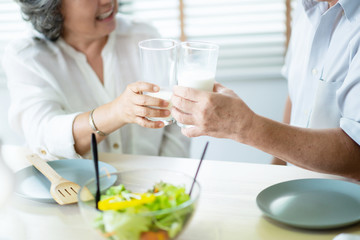 Asian couple having drinking milk.