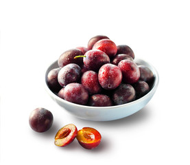Fresh plums in a bowl isolated