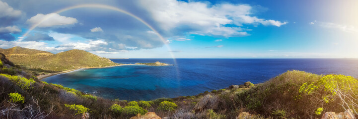 Rainbow over Punta Molentis (panoramic)