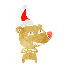 retro cartoon of a bear showing teeth wearing santa hat